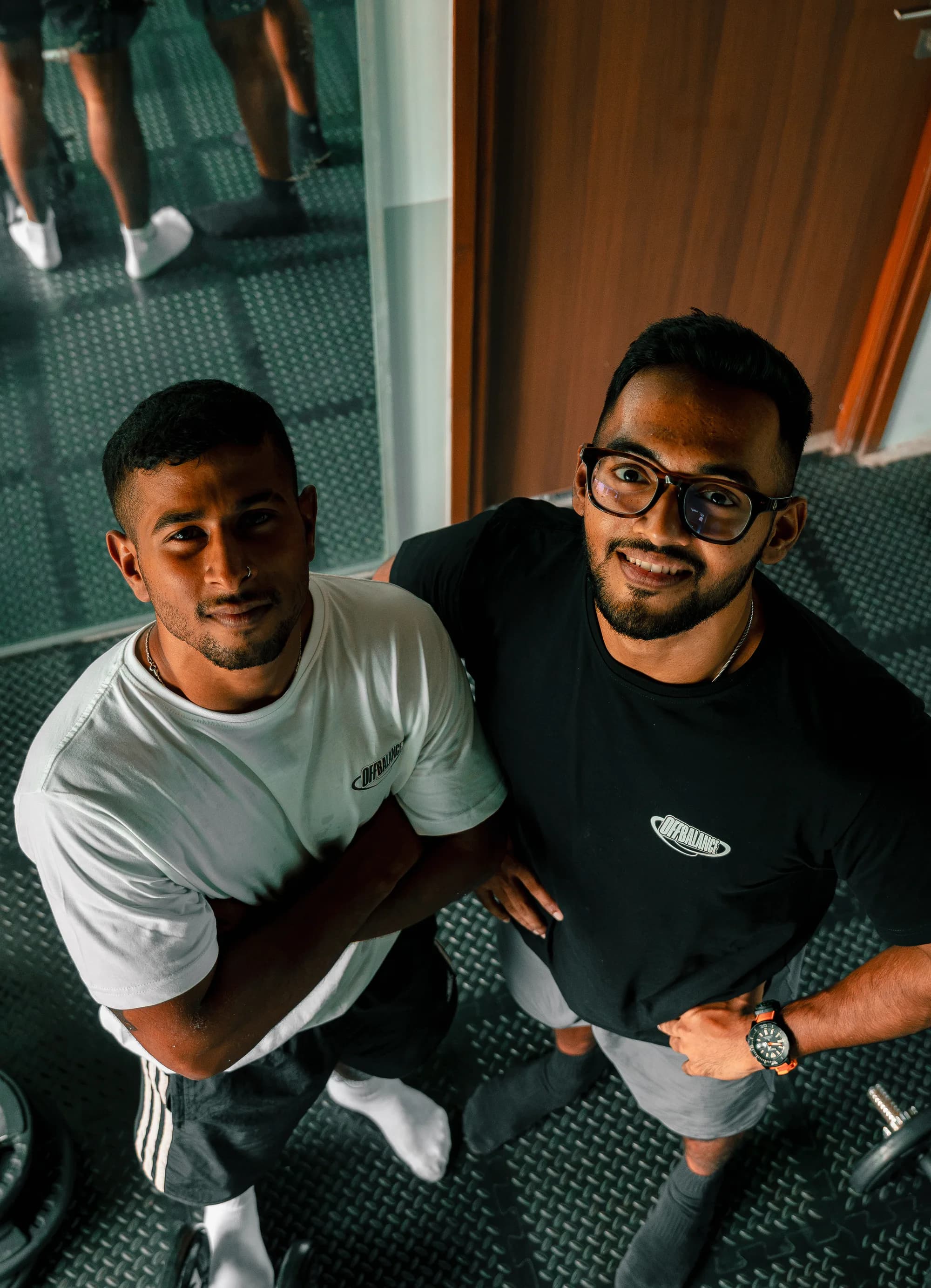 CJ and Achuthan looking up at the camera